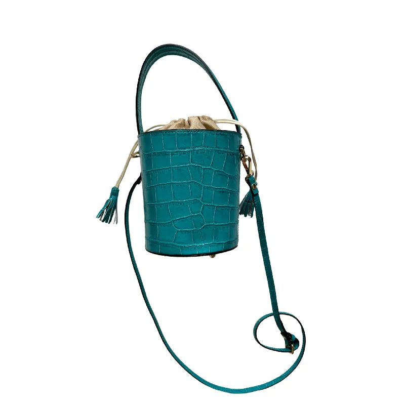 Affordable Luxury Jewelry For Every Occasion Colores Collective x Christina Greene Turquoise Croc Bucket Bag